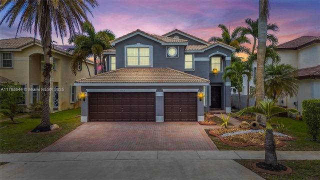 15862 SW 24th St, Miramar, FL 33027 - mediterranean / spanish house with a tile roof, stucco siding, and decorative driveway