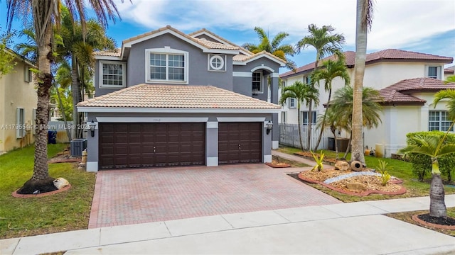 15862 SW 24th St, Miramar, FL 33027 - mediterranean / spanish home with stucco siding, a tile roof, and decorative driveway