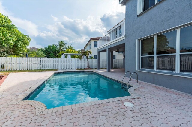 15862 SW 24th St, Miramar, FL 33027 - view of pool featuring a patio area and a fenced backyard