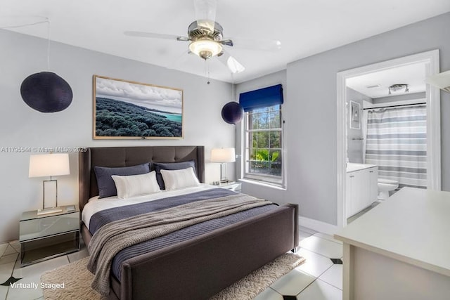 15862 SW 24th St, Miramar, FL 33027 - bedroom featuring light tile patterned floors, ensuite bath, and a ceiling fan