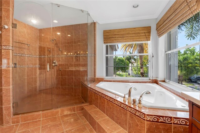 15862 SW 24th St, Miramar, FL 33027 - bathroom with a bath, a shower stall, tile patterned flooring, and vanity