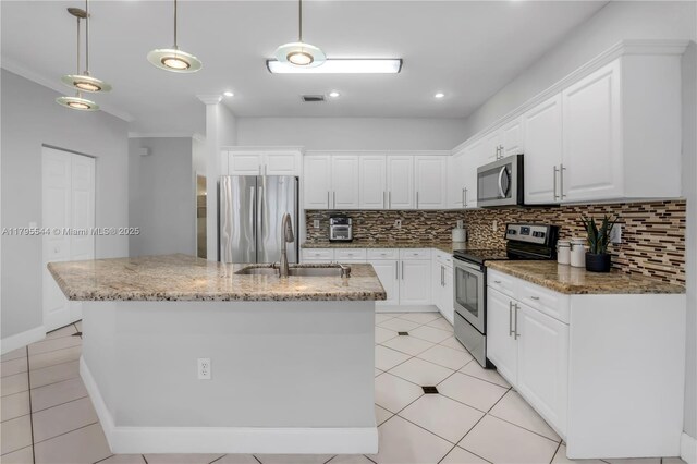 15862 SW 24th St, Miramar, FL 33027 - kitchen featuring appliances with stainless steel finishes, tasteful backsplash, white cabinetry, recessed lighting, and crown molding