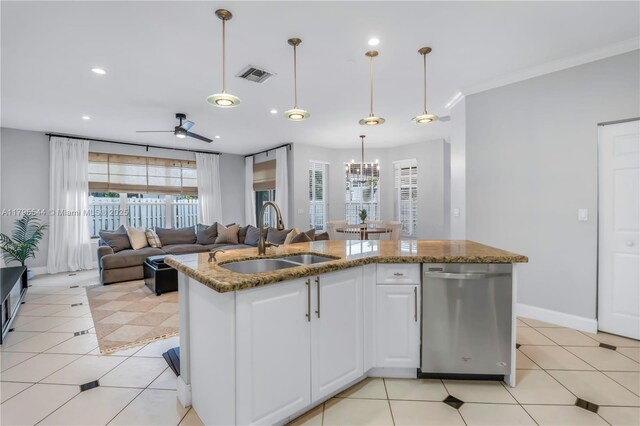 15862 SW 24th St, Miramar, FL 33027 - kitchen with stainless steel dishwasher, stone countertops, a ceiling fan, white cabinets, and decorative light fixtures