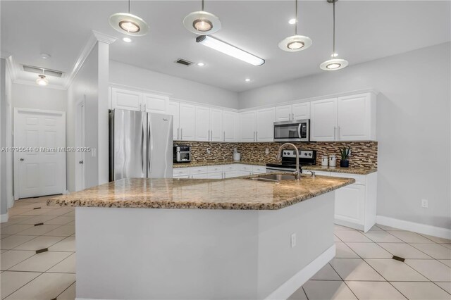 15862 SW 24th St, Miramar, FL 33027 - kitchen featuring stainless steel appliances, light tile patterned flooring, decorative backsplash, white cabinetry, and ornamental molding