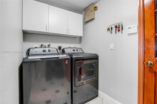 15862 SW 24th St, Miramar, FL 33027 - laundry area with cabinet space, separate washer and dryer, and tile patterned floors