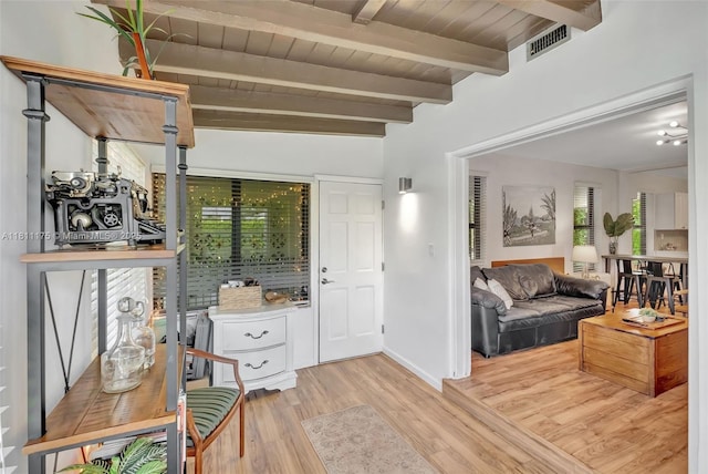2763 NW 3rd St, Miami, FL 33125 - entrance foyer with wood finished floors, wood ceiling with exposed beams, and baseboards