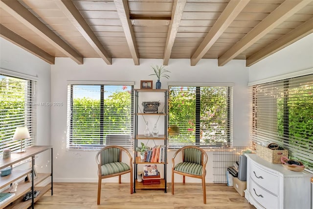 2763 NW 3rd St, Miami, FL 33125 - living area featuring light wood-type flooring, wooden ceiling with exposed beams, baseboards, and radiator heating unit