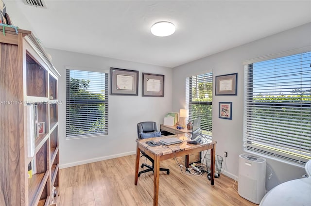 2763 NW 3rd St, Miami, FL 33125 - home office featuring light wood-style floors and baseboards