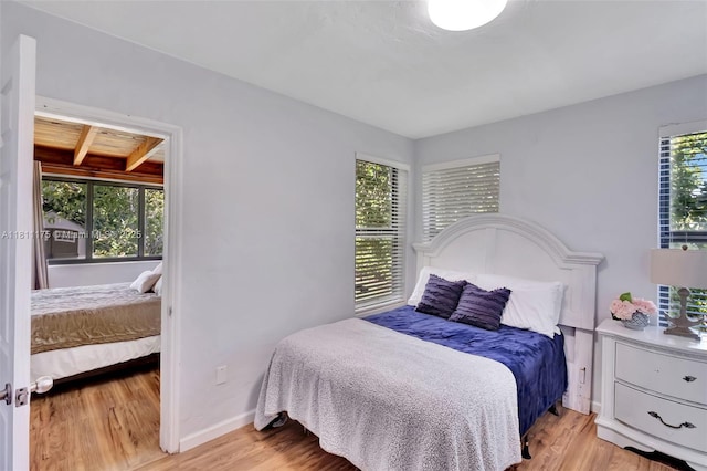2763 NW 3rd St, Miami, FL 33125 - bedroom featuring light wood-style flooring and baseboards