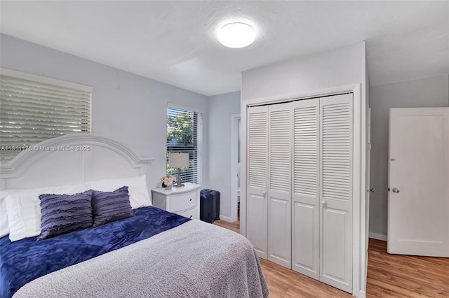 2763 NW 3rd St, Miami, FL 33125 - bedroom featuring light wood finished floors and a closet