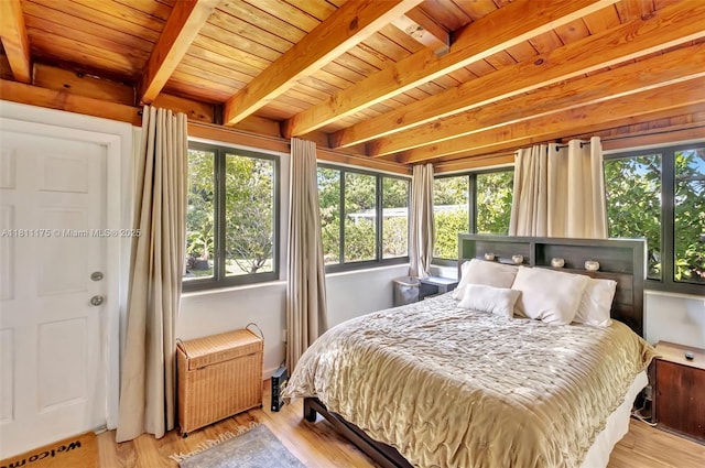 2763 NW 3rd St, Miami, FL 33125 - bedroom featuring wood ceiling with exposed beams, wood finished floors, and radiator