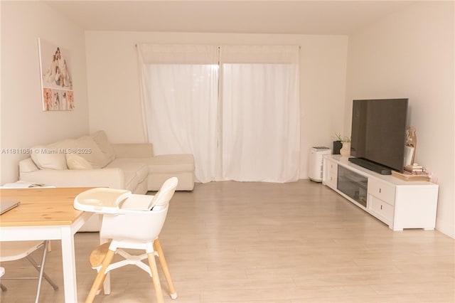 2200 S Cypress Bend Dr Unit 204, Pompano Beach, FL 33069 - living room featuring light wood-type flooring