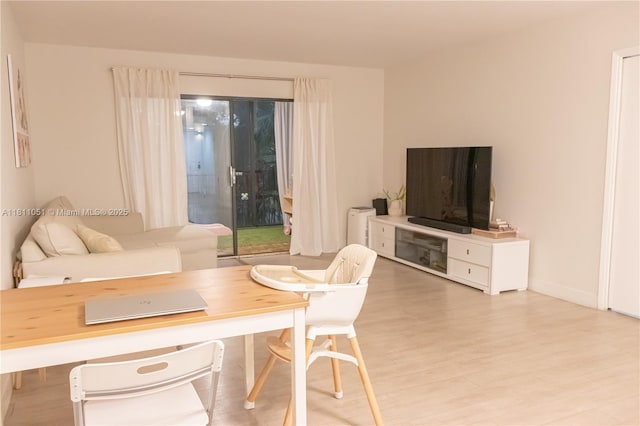 2200 S Cypress Bend Dr Unit 204, Pompano Beach, FL 33069 - living area featuring light wood-style floors and baseboards