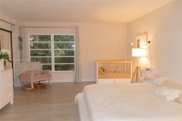 2200 S Cypress Bend Dr Unit 204, Pompano Beach, FL 33069 - bedroom with wood finished floors and baseboards