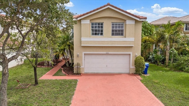 16466 SW 29th St, Miramar, FL 33027 - view of front facade with decorative driveway, stucco siding, an attached garage, and a front lawn