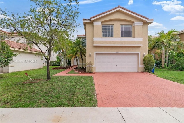 16466 SW 29th St, Miramar, FL 33027 - mediterranean / spanish-style home with decorative driveway, stucco siding, an attached garage, a front yard, and a tile roof