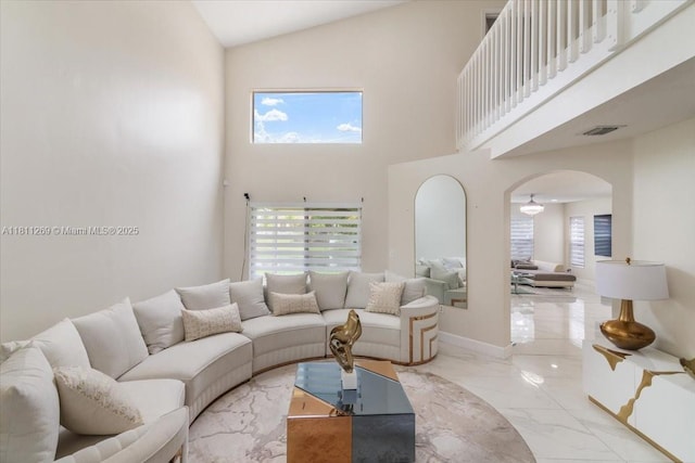 16466 SW 29th St, Miramar, FL 33027 - living area with marble tiled floors, arched walkways, high vaulted ceiling, and healthy amount of natural light