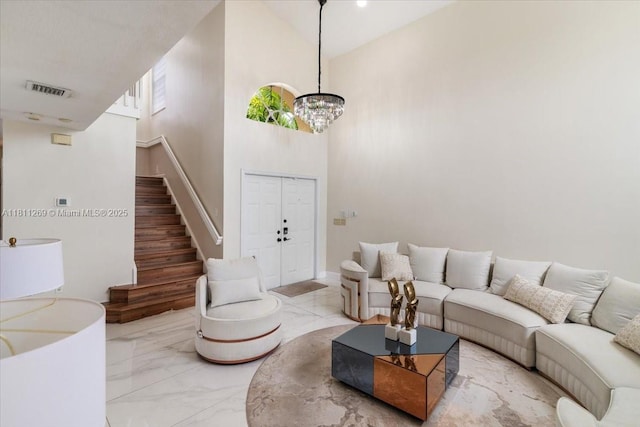 16466 SW 29th St, Miramar, FL 33027 - living area featuring stairs, marble finish flooring, a towering ceiling, and a chandelier