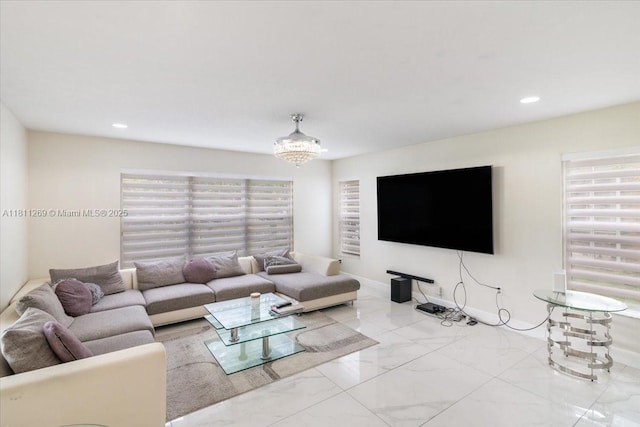 16466 SW 29th St, Miramar, FL 33027 - living area with marble finish flooring, recessed lighting, a chandelier, and baseboards