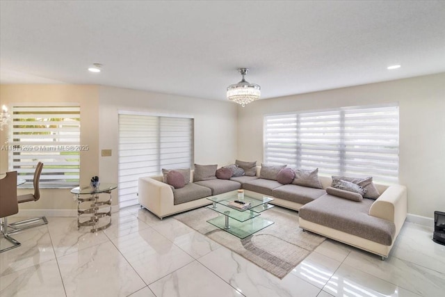 16466 SW 29th St, Miramar, FL 33027 - living room with marble look tiles, a chandelier, baseboards, and recessed lighting