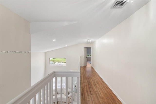 16466 SW 29th St, Miramar, FL 33027 - hallway with wood finished floors, an upstairs landing, recessed lighting, baseboards, and vaulted ceiling