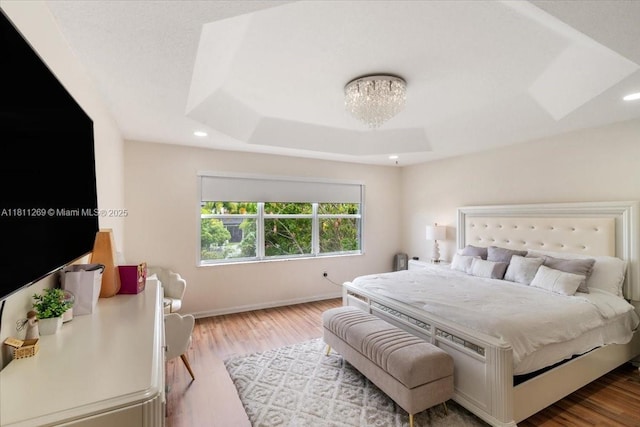 16466 SW 29th St, Miramar, FL 33027 - bedroom with a raised ceiling, wood finished floors, baseboards, recessed lighting, and a chandelier