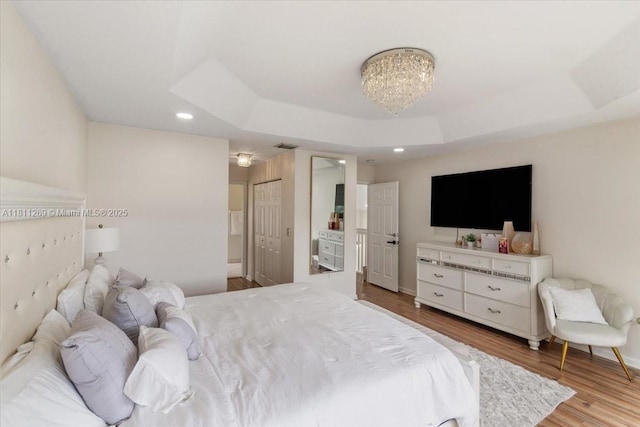 16466 SW 29th St, Miramar, FL 33027 - bedroom with a raised ceiling, wood finished floors, recessed lighting, baseboards, and a chandelier