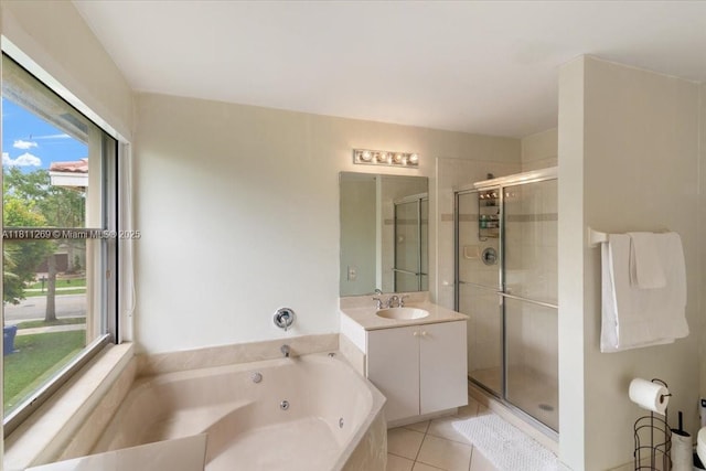 16466 SW 29th St, Miramar, FL 33027 - bathroom featuring a shower stall, a jetted tub, vanity, and tile patterned flooring