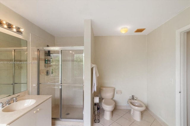 16466 SW 29th St, Miramar, FL 33027 - bathroom featuring a bidet, vanity, toilet, a shower stall, and tile patterned flooring