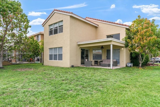 16466 SW 29th St, Miramar, FL 33027 - back of property featuring a ceiling fan, stucco siding, an outdoor hangout area, and a lawn