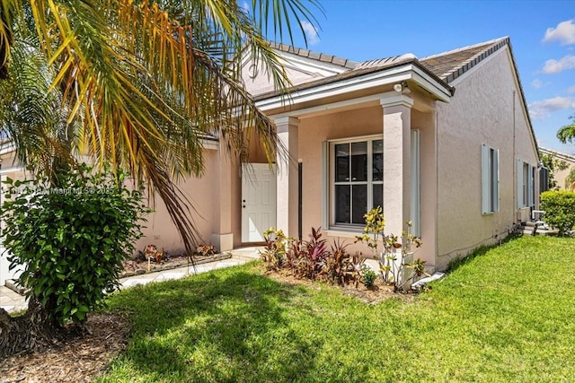 930 Briar Ridge Rd, Weston, FL 33327 - view of property exterior with a lawn and stucco siding