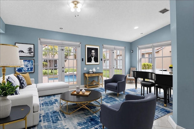 930 Briar Ridge Rd, Weston, FL 33327 - living area with french doors, a textured ceiling, healthy amount of natural light, baseboards, and vaulted ceiling