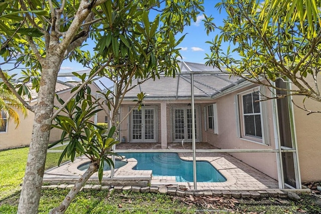 930 Briar Ridge Rd, Weston, FL 33327 - swimming pool with french doors, a patio area, and a lanai