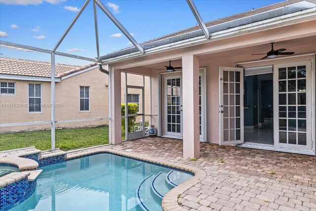 930 Briar Ridge Rd, Weston, FL 33327 - view of pool featuring a ceiling fan, a patio, glass enclosure, and a pool with connected hot tub