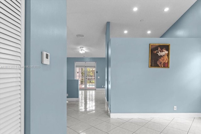 930 Briar Ridge Rd, Weston, FL 33327 - hallway featuring recessed lighting, baseboards, light tile patterned floors, and a textured ceiling