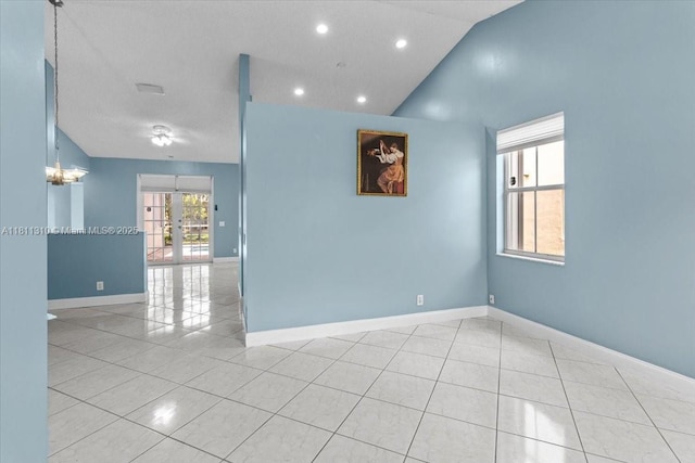 930 Briar Ridge Rd, Weston, FL 33327 - empty room with tile patterned flooring, french doors, baseboards, vaulted ceiling, and recessed lighting