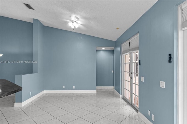 930 Briar Ridge Rd, Weston, FL 33327 - tiled empty room featuring plenty of natural light, a textured ceiling, baseboards, and lofted ceiling