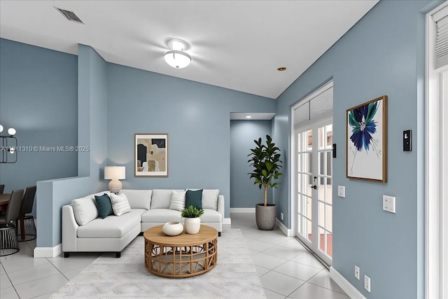930 Briar Ridge Rd, Weston, FL 33327 - living area with vaulted ceiling, tile patterned flooring, baseboards, and french doors