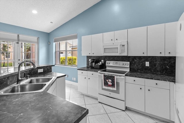 930 Briar Ridge Rd, Weston, FL 33327 - kitchen with white appliances, vaulted ceiling, a sink, tasteful backsplash, and dark countertops