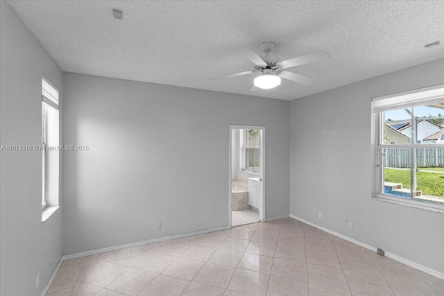 930 Briar Ridge Rd, Weston, FL 33327 - unfurnished room featuring a textured ceiling, a ceiling fan, baseboards, and light tile patterned floors