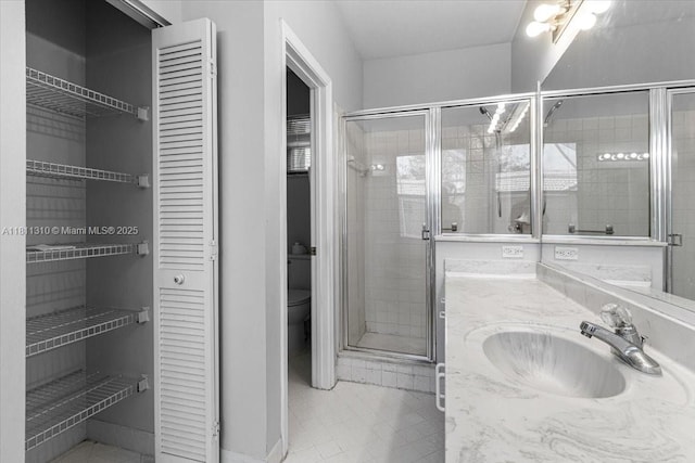 930 Briar Ridge Rd, Weston, FL 33327 - full bathroom featuring a closet, vanity, a stall shower, toilet, and tile patterned flooring