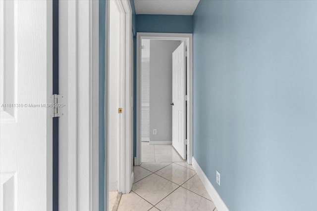 930 Briar Ridge Rd, Weston, FL 33327 - hallway with light tile patterned floors and baseboards