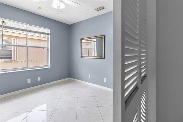 930 Briar Ridge Rd, Weston, FL 33327 - unfurnished room featuring a ceiling fan, baseboards, light tile patterned floors, and a textured ceiling