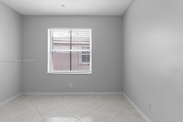 930 Briar Ridge Rd, Weston, FL 33327 - empty room with a textured ceiling, baseboards, and light tile patterned floors