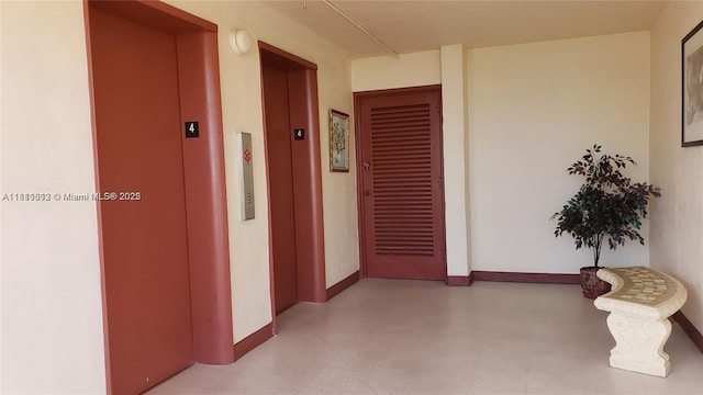 2905 Point E Dr Unit L402, Aventura, FL 33160 - corridor featuring elevator and baseboards
