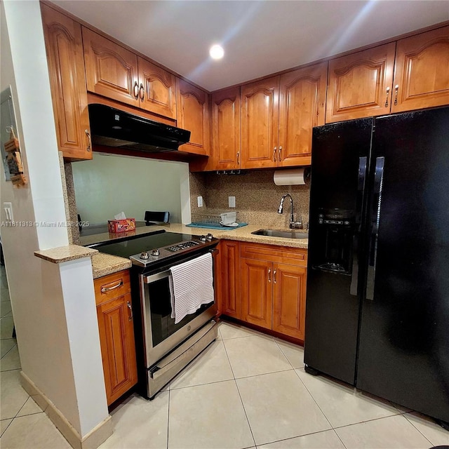 2905 Point E Dr Unit L402, Aventura, FL 33160 - kitchen featuring black refrigerator with ice dispenser, stainless steel range with electric cooktop, a sink, exhaust hood, and light tile patterned floors