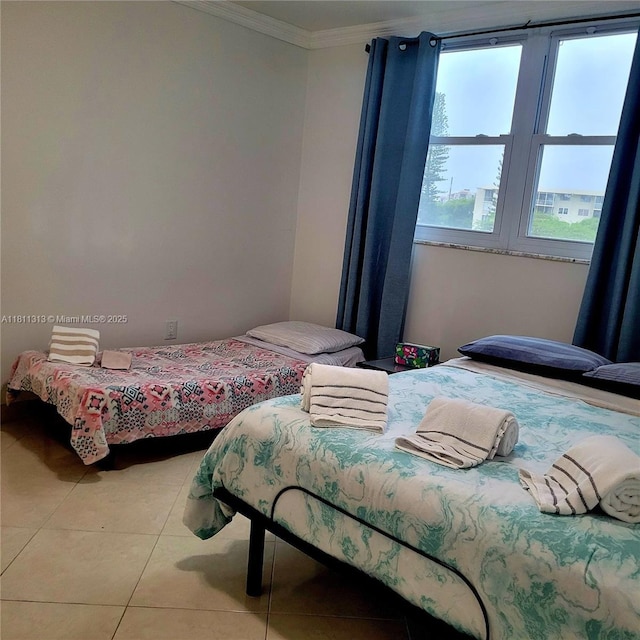 2905 Point E Dr Unit L402, Aventura, FL 33160 - bedroom with crown molding and light tile patterned flooring