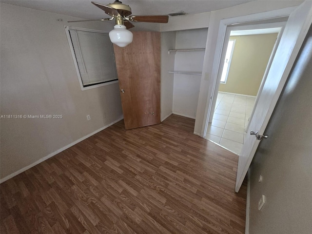 1521 Richmond Rd, Lakeland, FL 33805 - unfurnished bedroom featuring wood finished floors, baseboards, and a ceiling fan