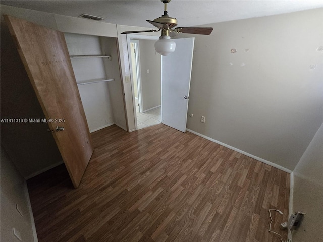 1521 Richmond Rd, Lakeland, FL 33805 - unfurnished bedroom with wood finished floors, baseboards, and a ceiling fan