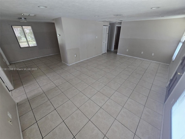 1521 Richmond Rd, Lakeland, FL 33805 - spare room with baseboards and light tile patterned flooring